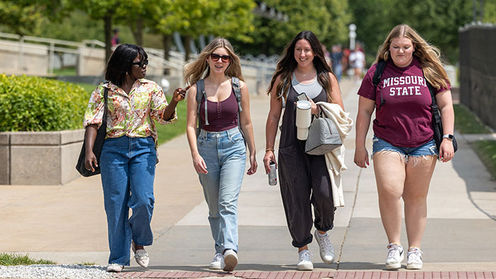 female missouri state students walking across campus
